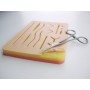 Suture exercise pad with net